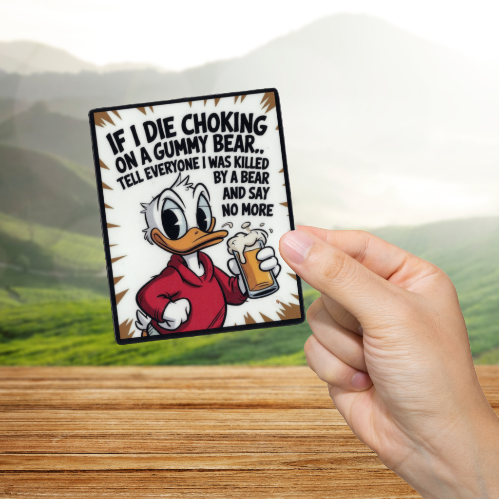 Cartoon character holding a mug with humorous text, held by a hand against a scenic background. 'If I die choking, tell everyone I was killed by a bear.'