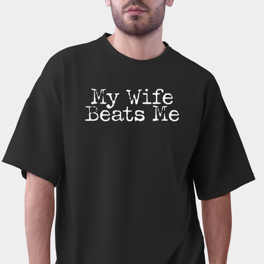 Ollie's: My Wife Beats Me T-Shirt, Dark - 100% Cotton