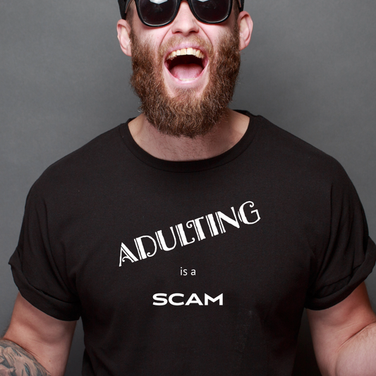 Ollie's: "Adulting Is a Scam" - 100% Cotton Graphic T-Shirt