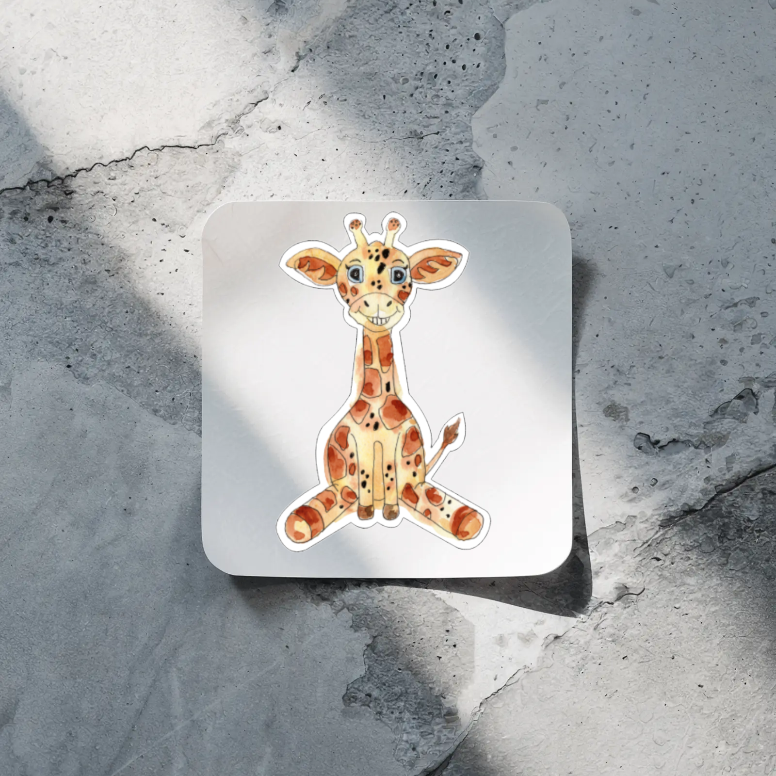 Sticker of a giraffe on a textured stone surface