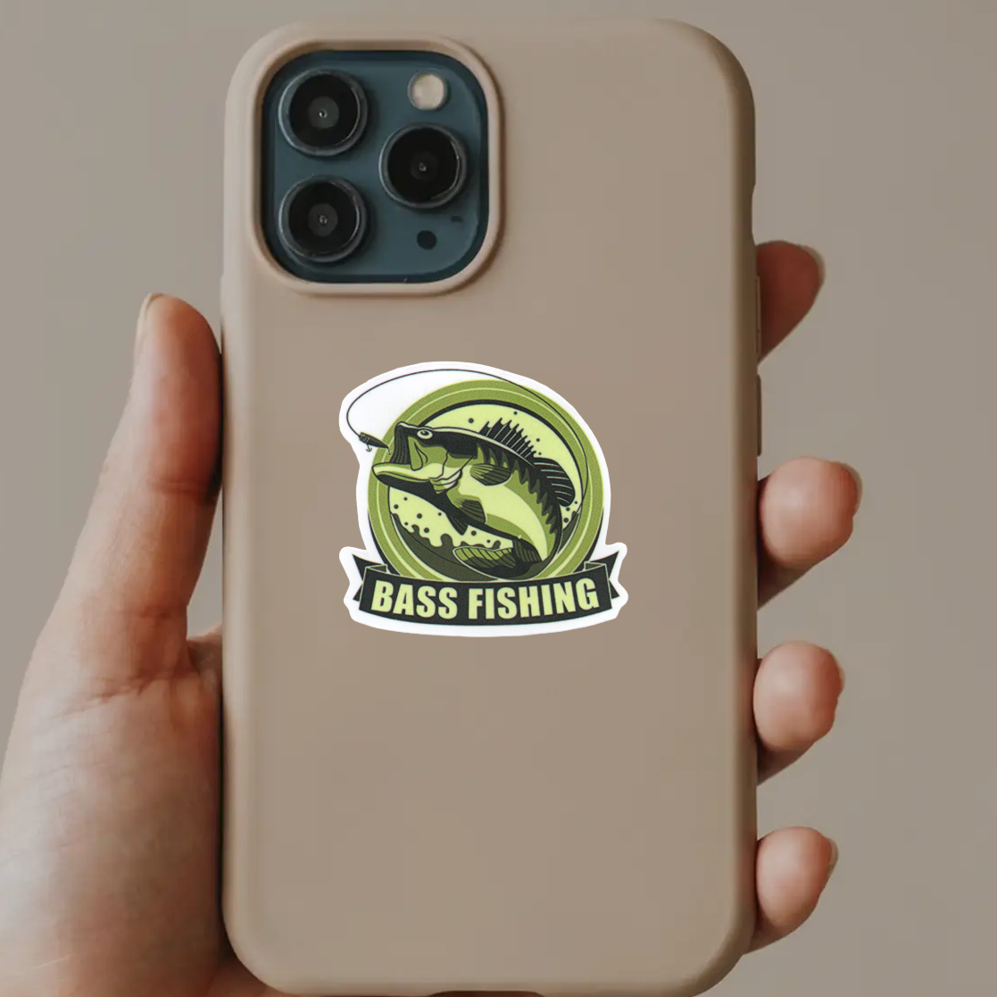 Phone case with bass fishing design held by a hand against a neutral background