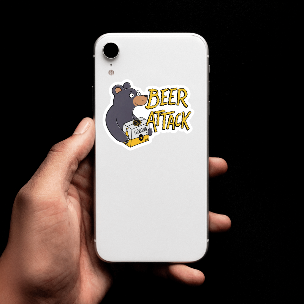 White phone with 'Beer Attack' bear design sticker. Durable vinyl, die-cut.