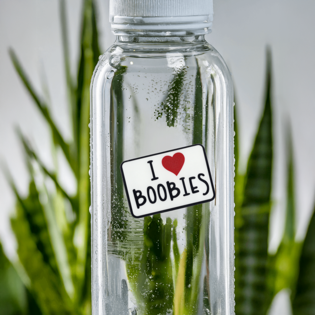 Clear water bottle with 'I ❤️ BOOBIES' sticker. Durable vinyl, die-cut sticker.