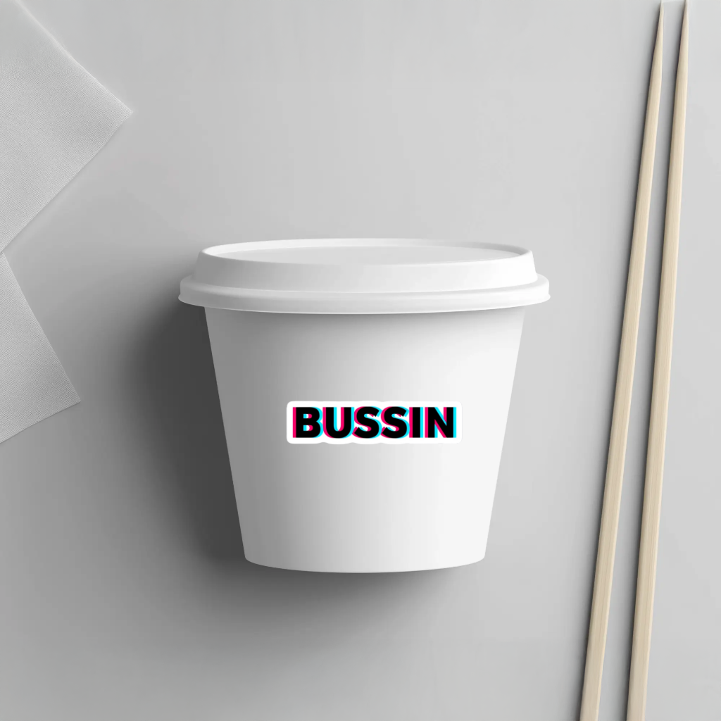 White paper cup with a 'BUSSIN' sticker. Durable vinyl die-cut sticker.
