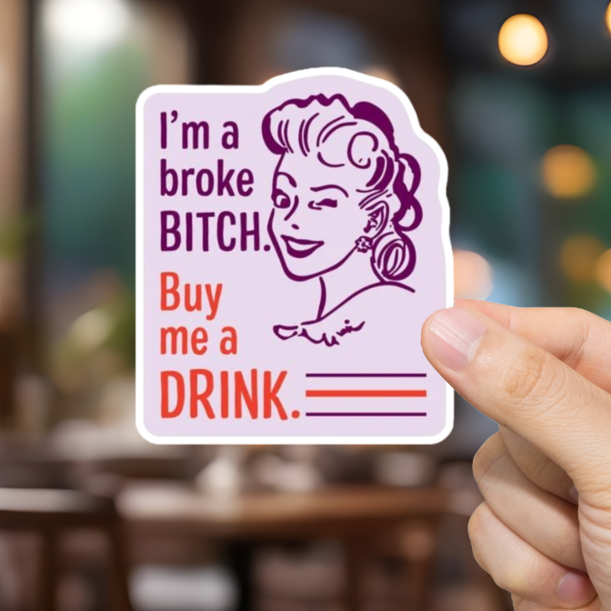 Hand holding a card with text in a restaurant setting. I'm a Broke Bitch.  Buy me a drink!