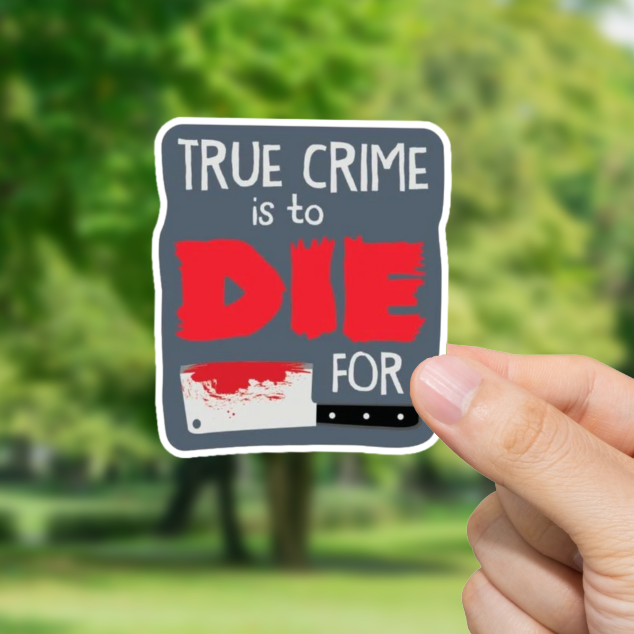 Hand holding a 'True Crime is to Die for' sticker with a blurred green outdoor background