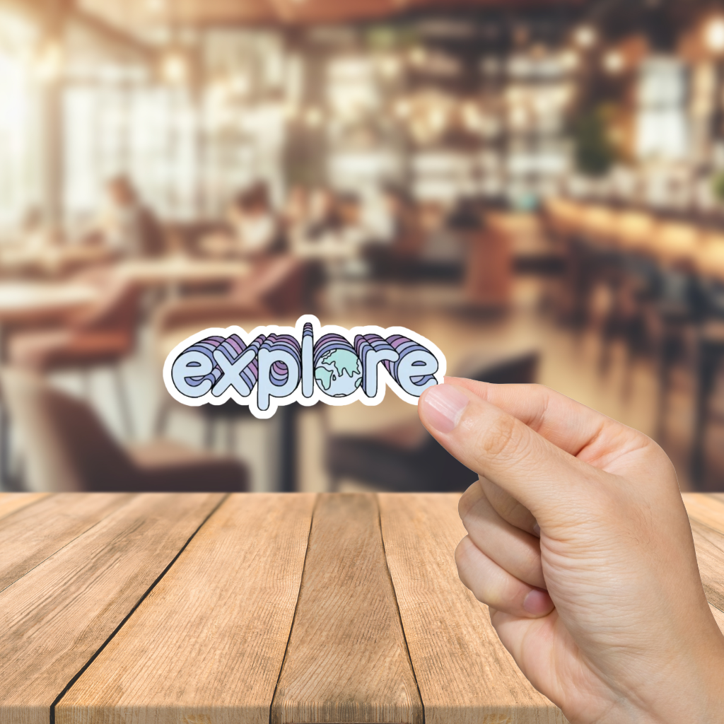 Hand holding a 'explore' sticker over a blurred restaurant background