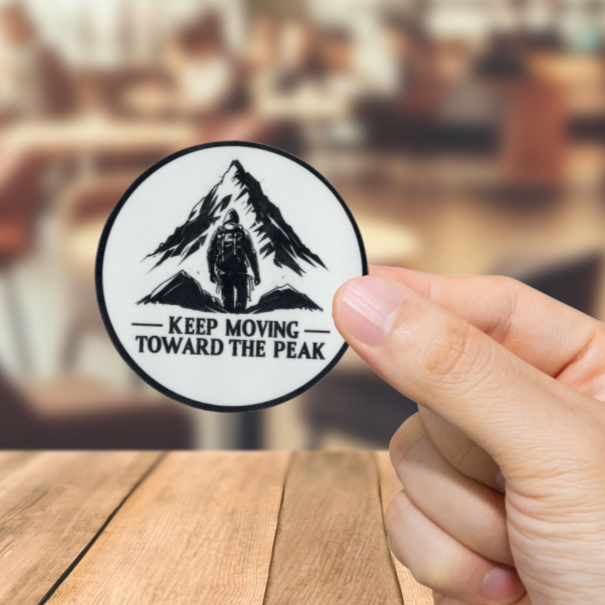 Durable, vinyl, die-cut, Keep Moving To The Peak Sticker.