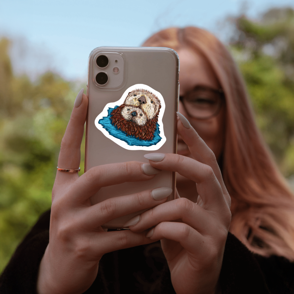 Durable, vinyl, die-cut, Mom &amp; Baby Otter Art Sticker.