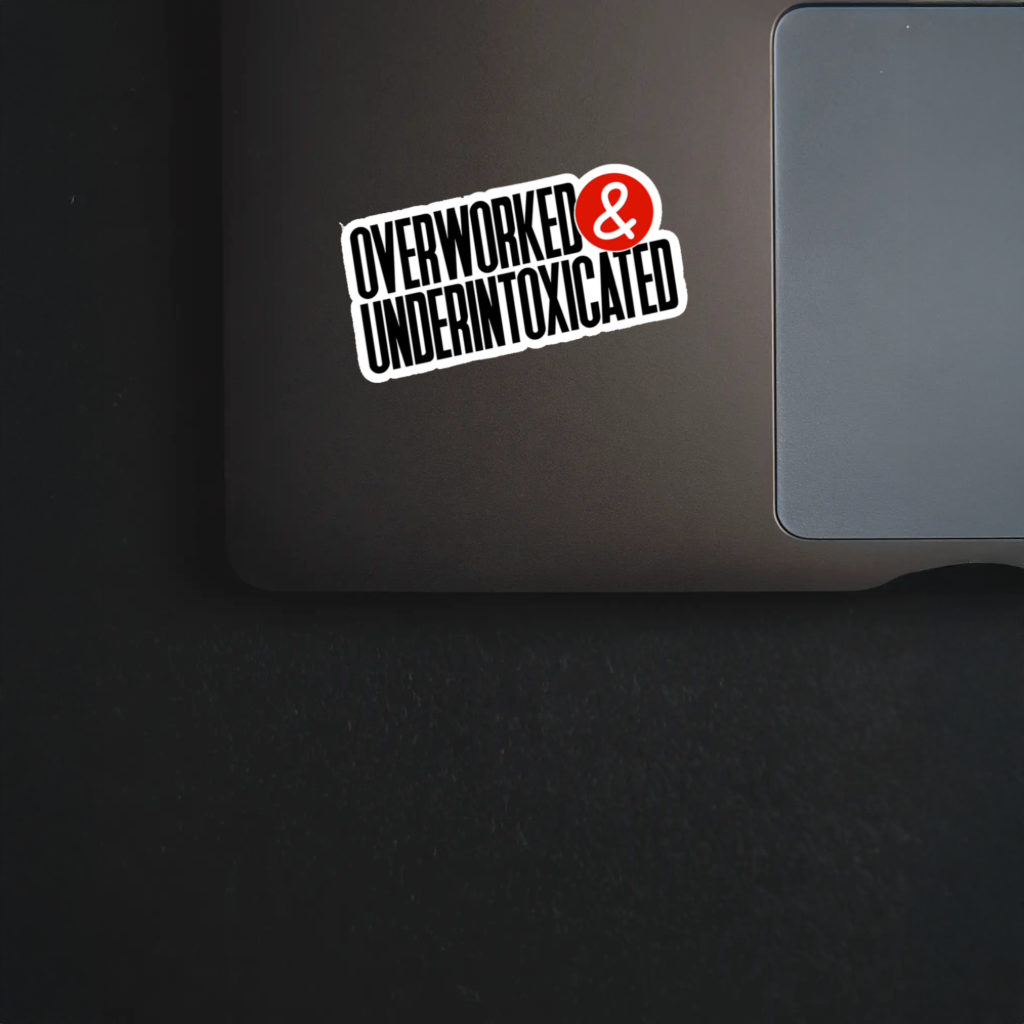 Durable, vinyl, die-cut, Overworked &amp; Under Intoxicated Sticker.