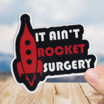 Durable, vinyl, die-cut, It Ain't Rocket Surgery Sticker.