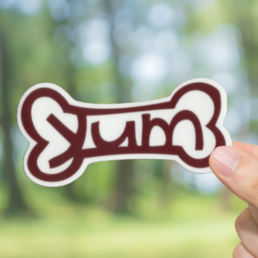 Durable, vinyl, die-cut, Yum Dog Bone Sticker.