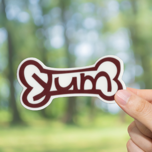 Durable, vinyl, die-cut, Yum Dog Bone Sticker.
